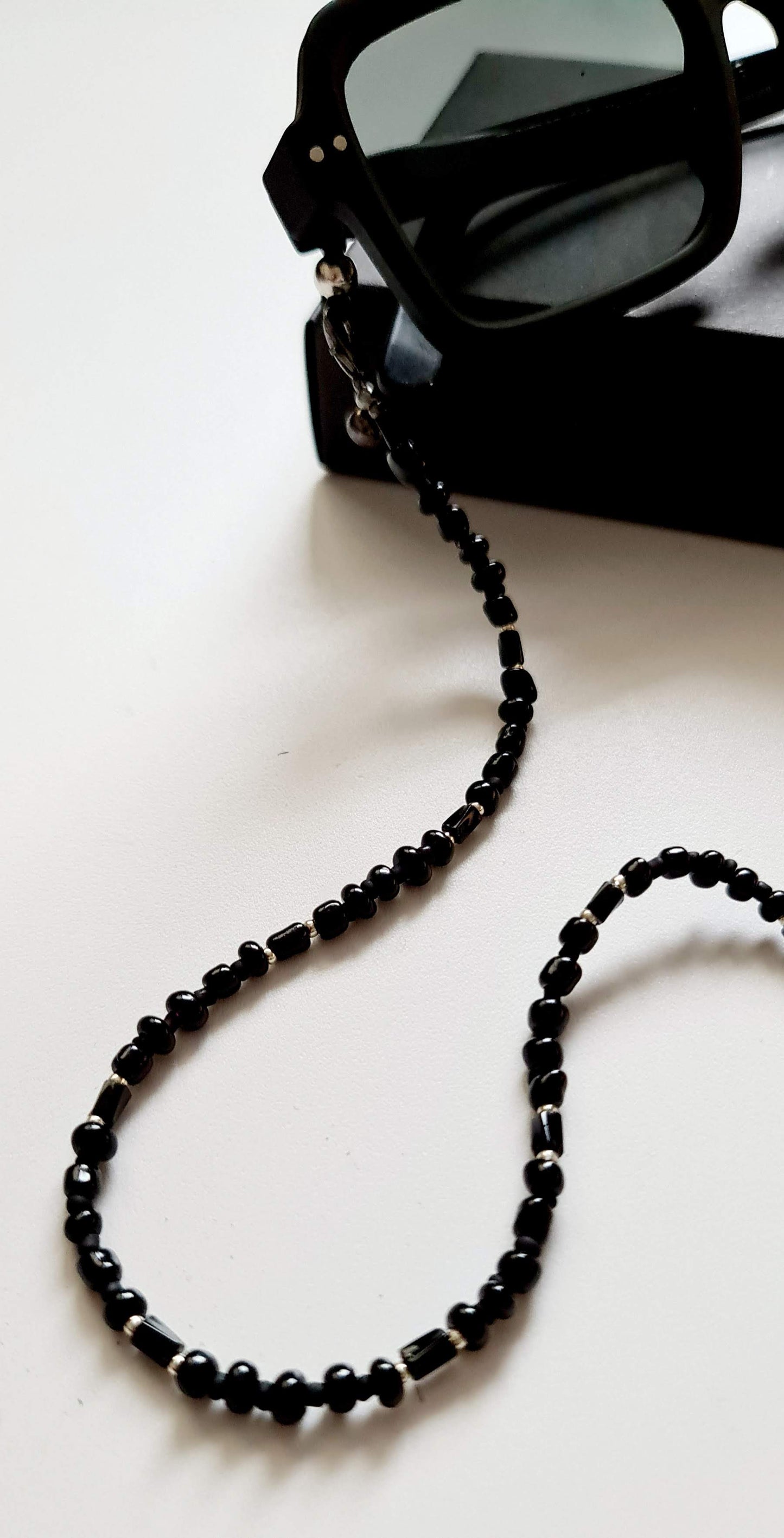 Black beaded eyeglasses and earphone holder chain