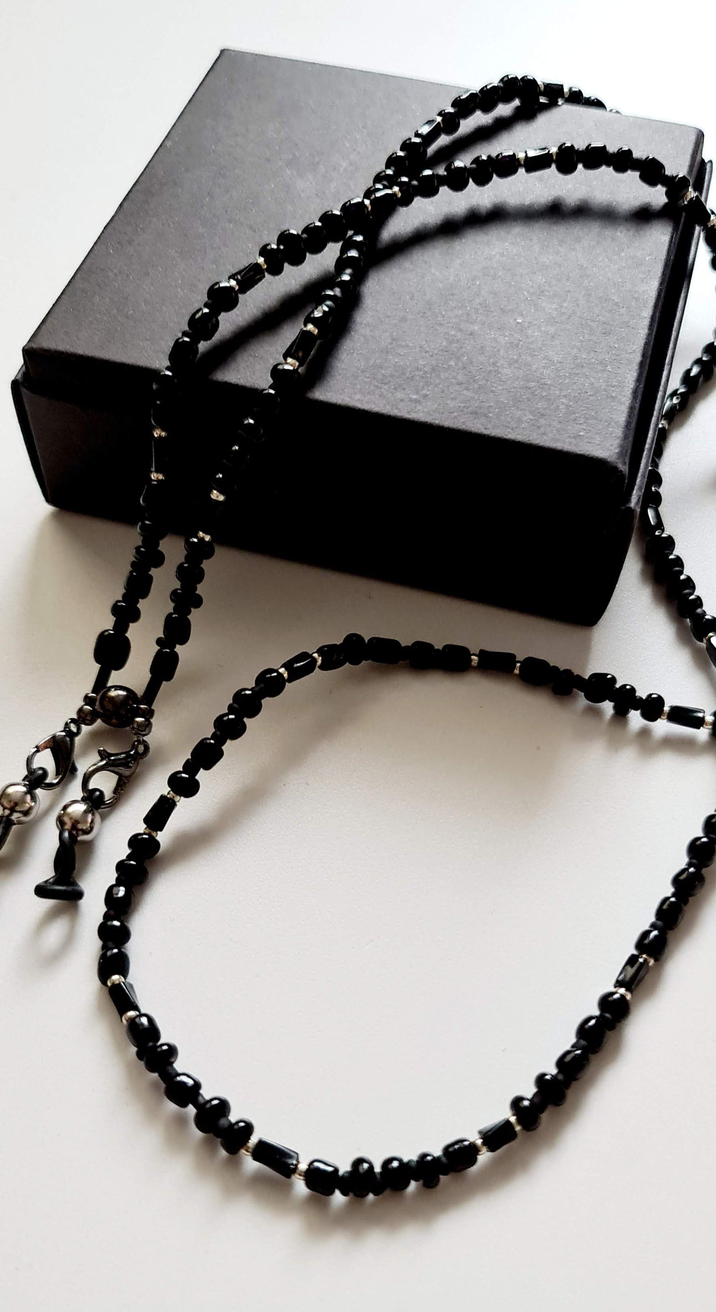 Black beaded eyeglasses and earphone holder chain